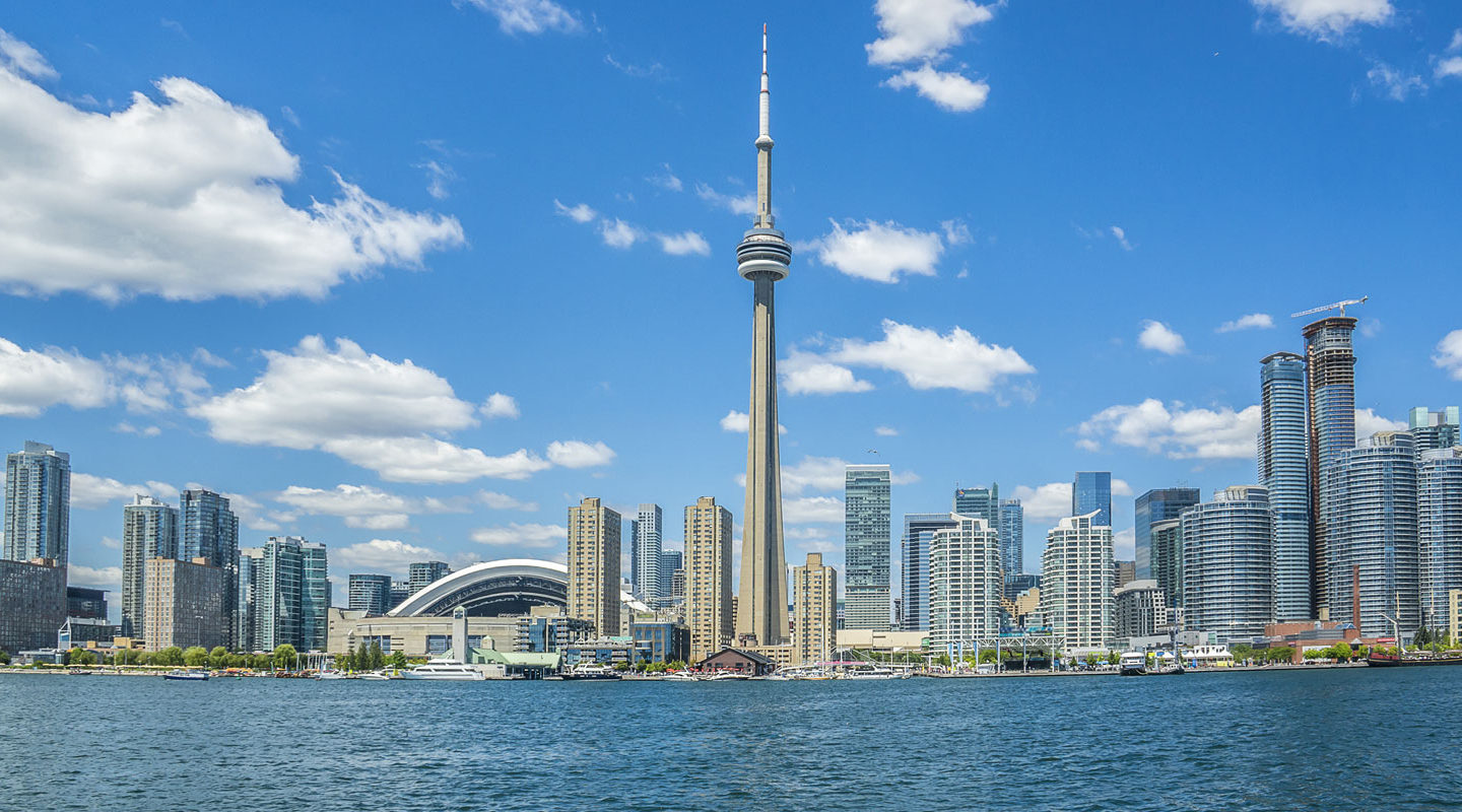 a large body of water with a city in the background