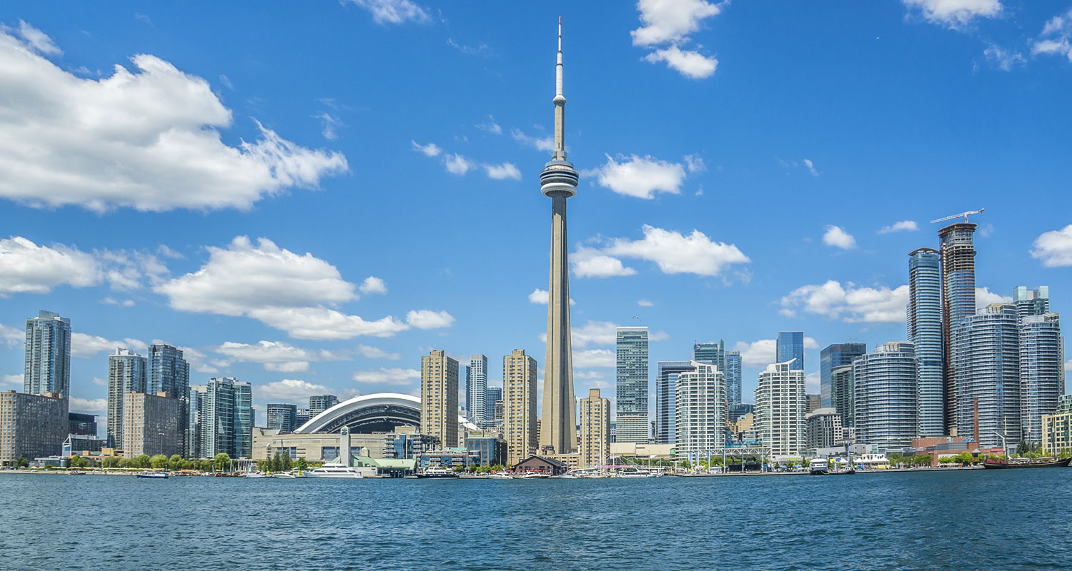 a large body of water with a city in the background