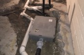 a water heater exposed in a ditch in a basement