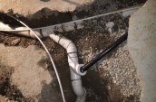 water pipes exposed under dug up concrete