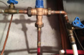 a couple of pipes that are connected to a wall