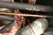 a copper pipe among some insulating material