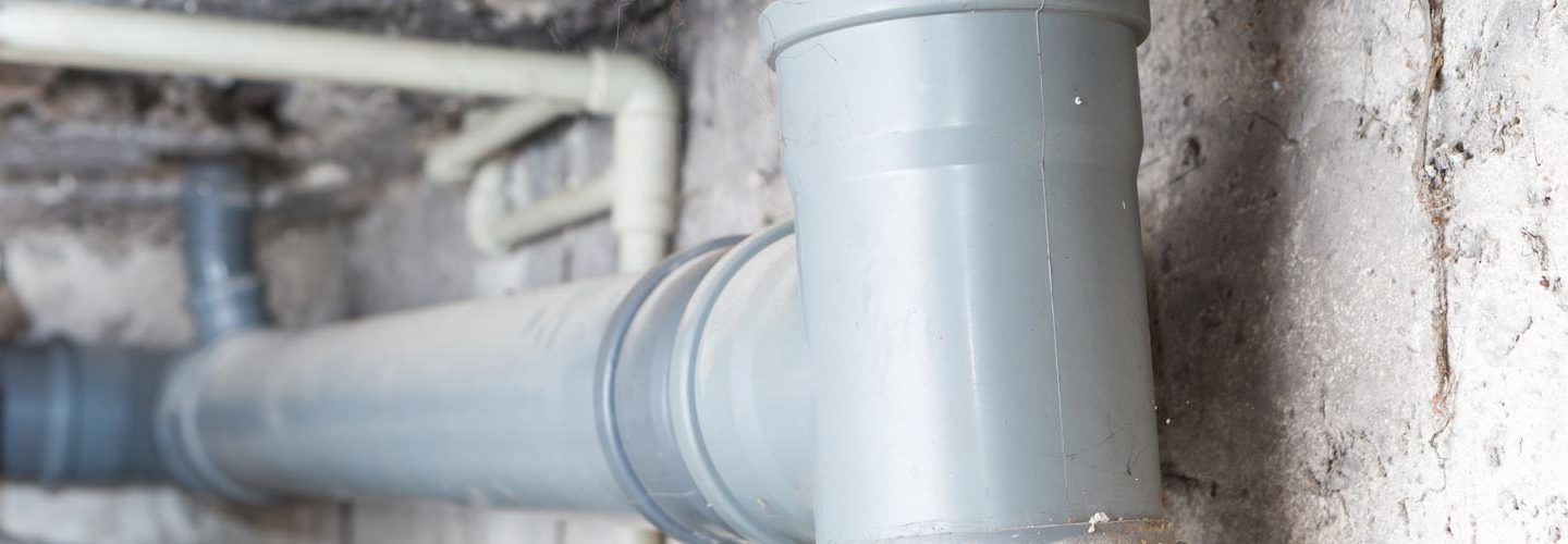 water pipes running along a wall